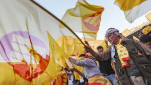 Supporters of the Kurdistan Democratic Party wave KDP flags during an election rally in Erbil. Getty Images 